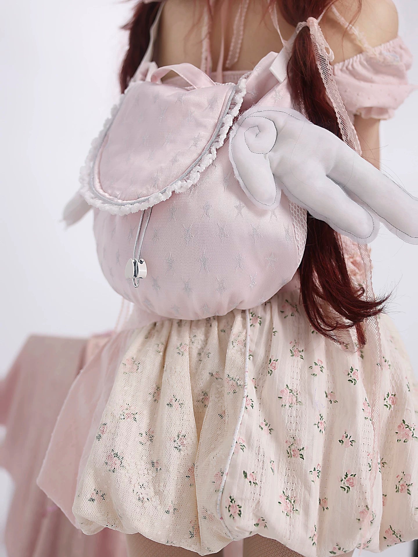 A closer look at Rose Island flying wings backpack, with coquette core style design in PeilieeShop
