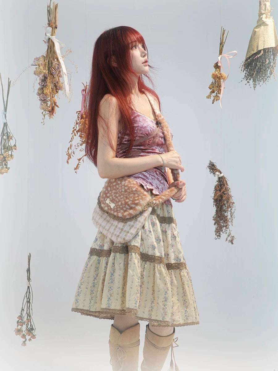 Rose Island Deer collection fawn pattern print cross body shoulder bag on model studio photo from side view