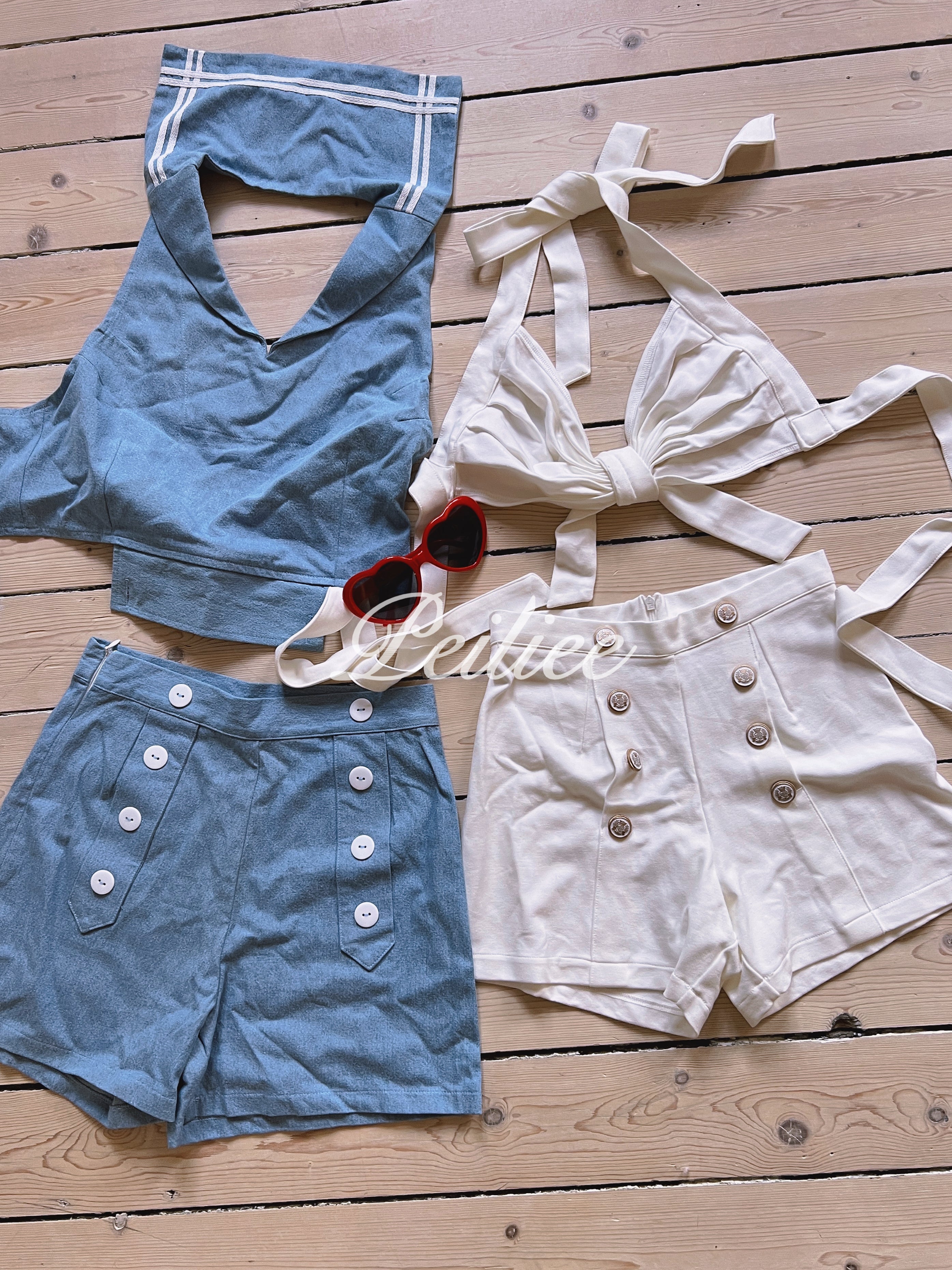 Vintage 1997 inspired Blue and white outfits set with buttons on a wooden surface matching heart shaped sunglasses