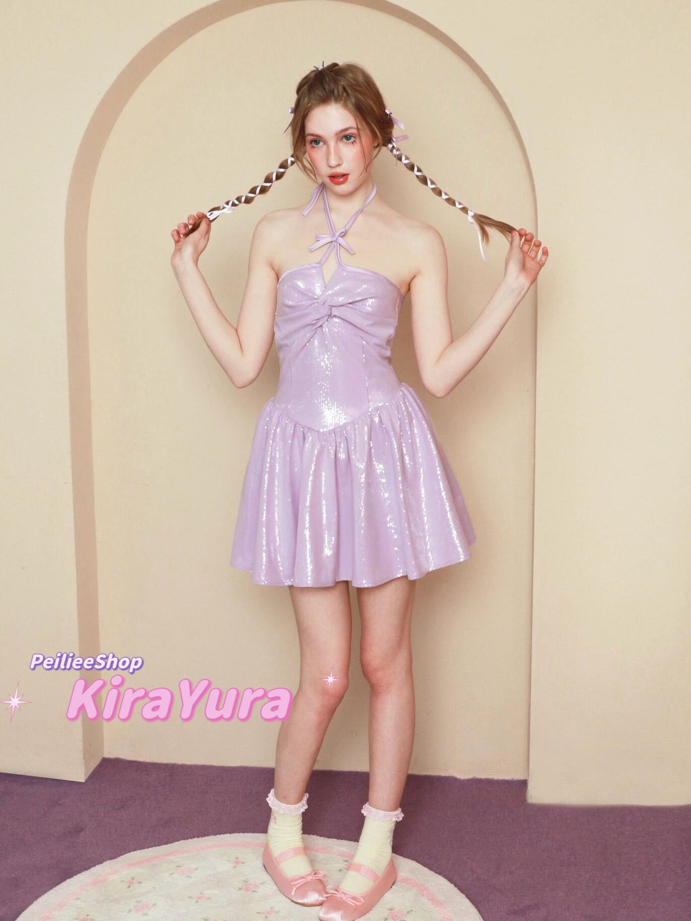 Woman in a purple glitter minin dress standing in front of an archway with 'PeilieeShop KiraYura' branding.