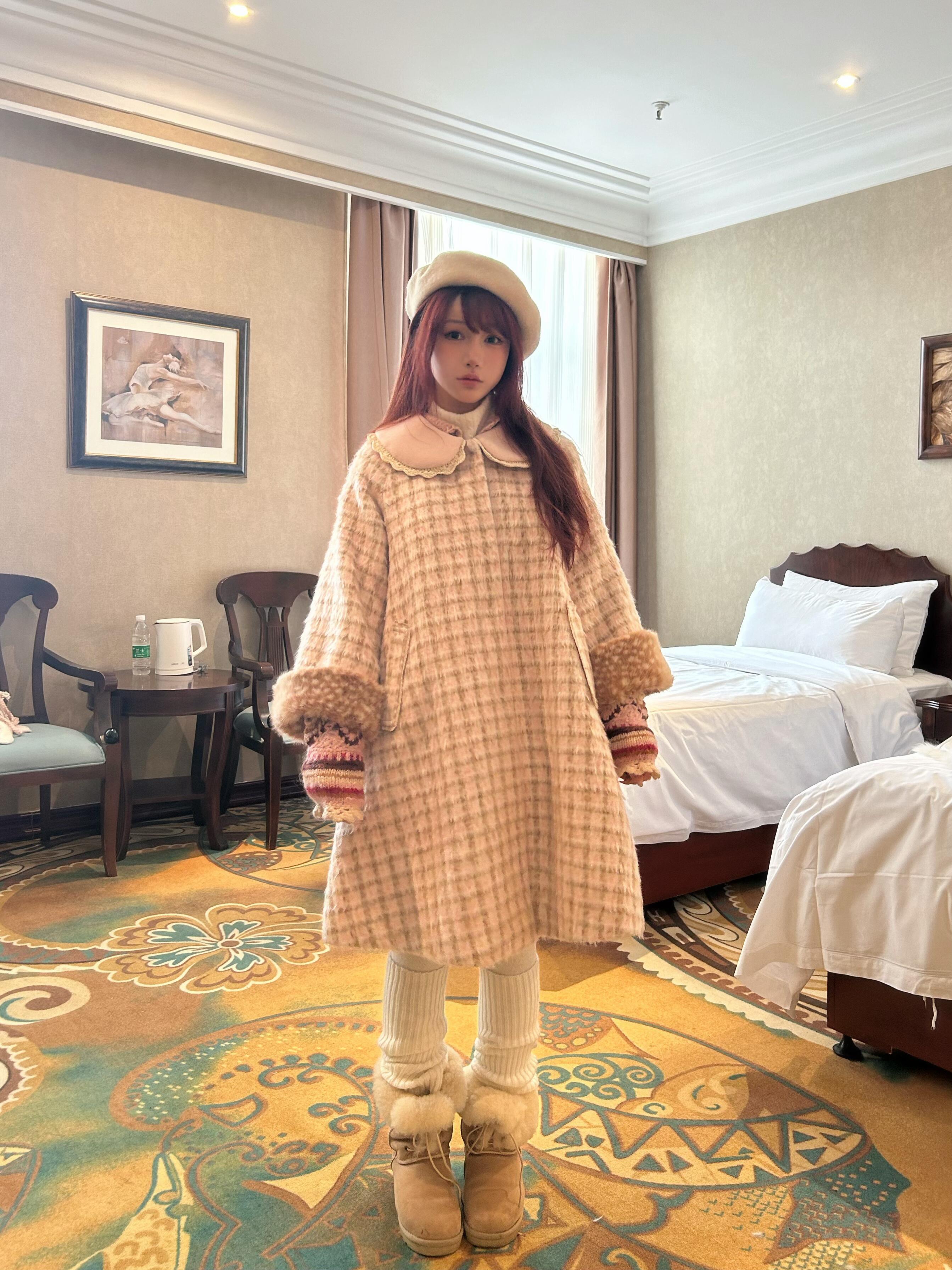 Woman in a deer fawn print plaid dress standing/