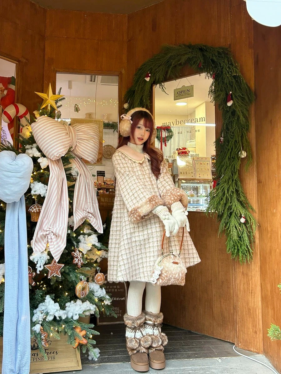 Woman in a plaid fawn deer dress standing in a decorated room with Christmas decorations.