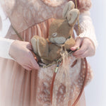 Rose Island Deer collection fawn pattern print faux fur handbag model holding with bunny doll inside