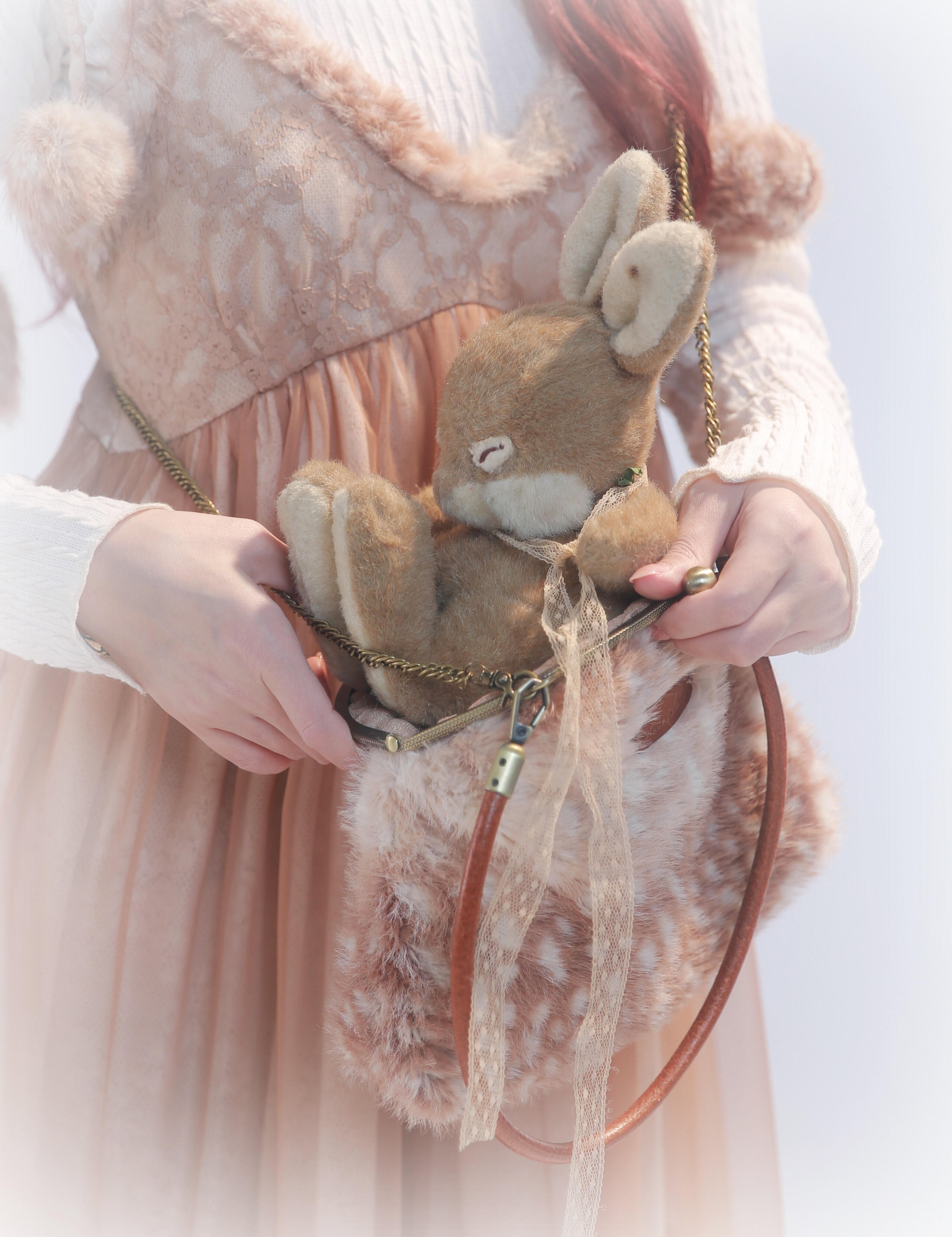 Rose Island Deer collection fawn pattern print faux fur handbag model holding with bunny doll inside
