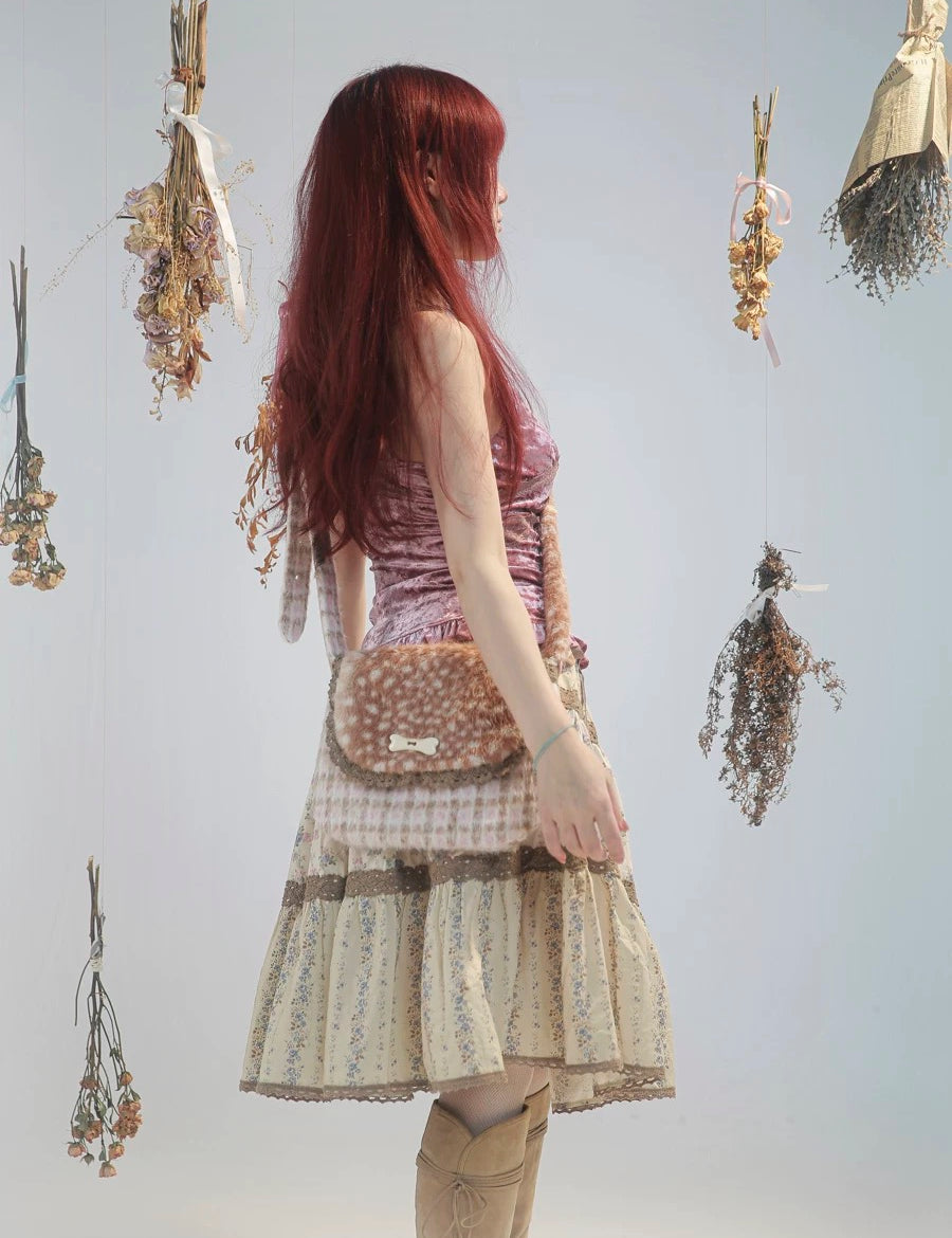 Rose Island Deer collection fawn pattern print cross body shoulder bag on model - side photo