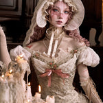 woman in a historical costume with lace dress and bonnet, surrounded by candles.