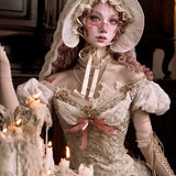 woman in a historical costume with lace dress and bonnet, surrounded by candles.