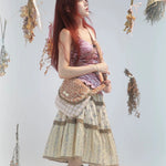 Rose Island Deer collection fawn pattern print cross body shoulder bag on model studio photo from side view