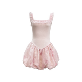 Pink ballet dress with a tutu on a white background